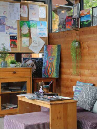 Cozy creative art corner at GlampEco's Glass Cafe in Manali