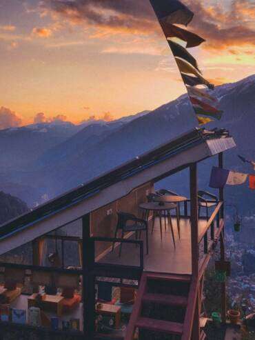 Spectacular sunset mountain views from romantic GlampEco Glass Cafe in Manali