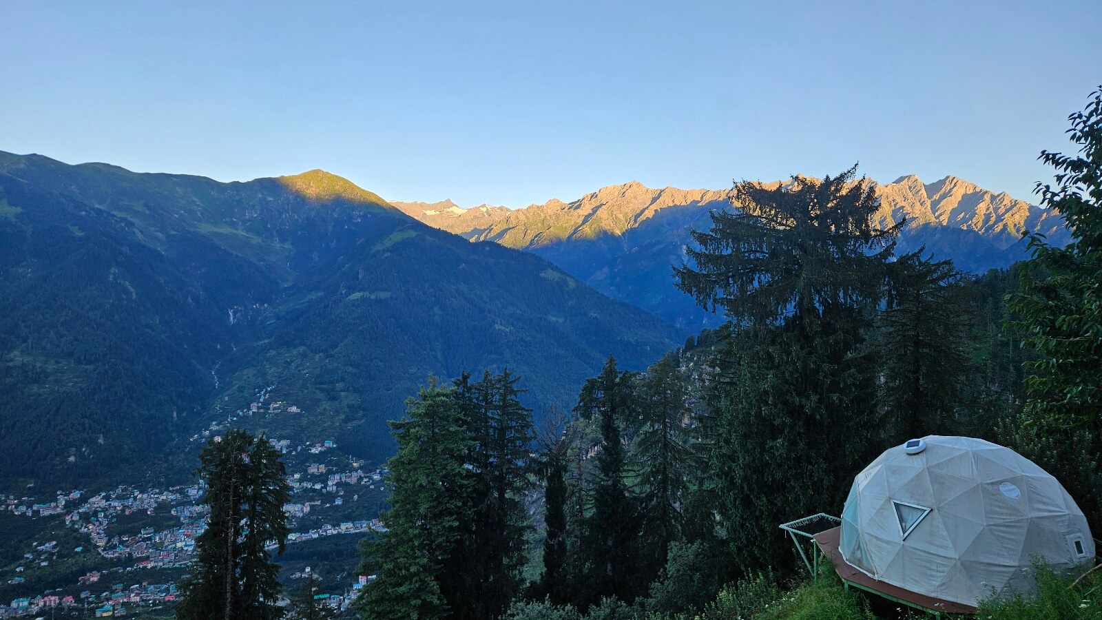 Sunrise mountain view at luxury glamping site GlampEco Manali