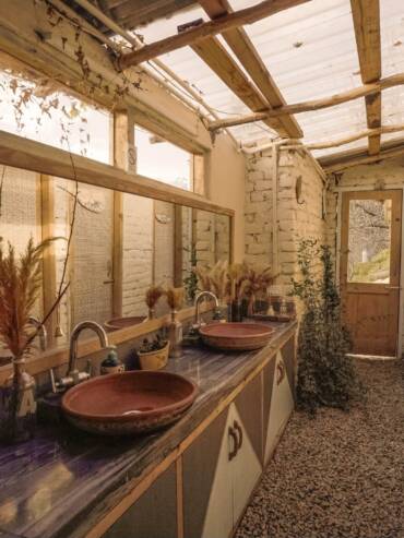 Hygiene standards in mudhouse's common restrooms at GlampEco Manali