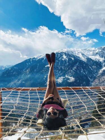 Guest relaxing at luxury dome outdoor chill space of GlampEco Manali