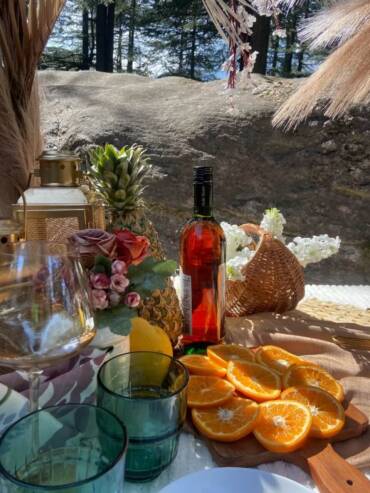 Celebrating with a romantic outdoor setup in a forest near GlampEco Manali